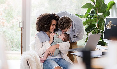 Happy adoptive family in their home