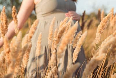 pregnant woman in a field in South Dakota